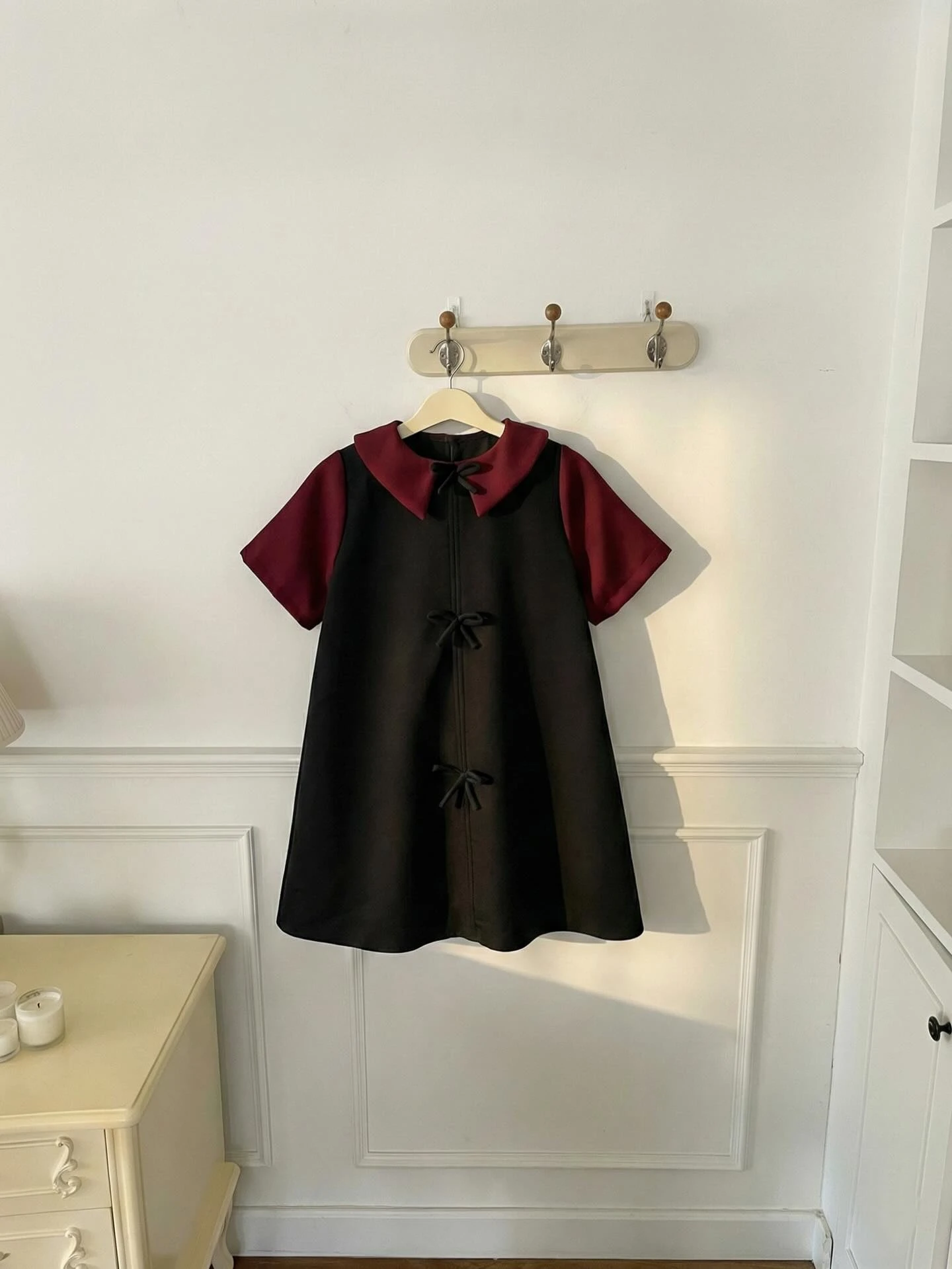 Đầm babydoll đen nơ phối đỏ đô